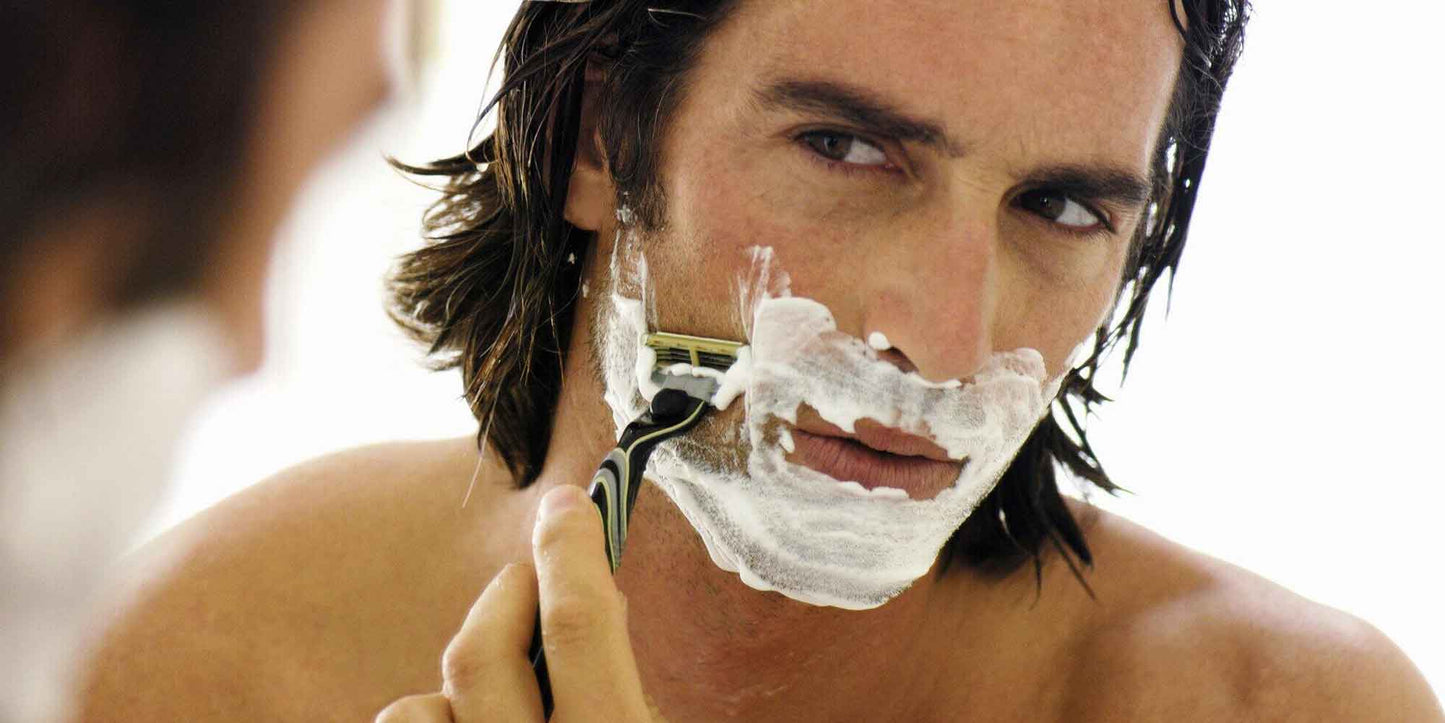 the-modern-gentleman-man-shaving-in-mirror
