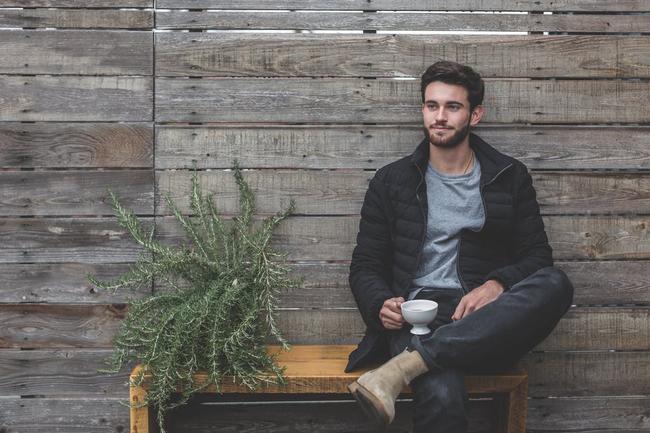 the-modern-gentleman-stylish-man-sitting-with-a-coffee