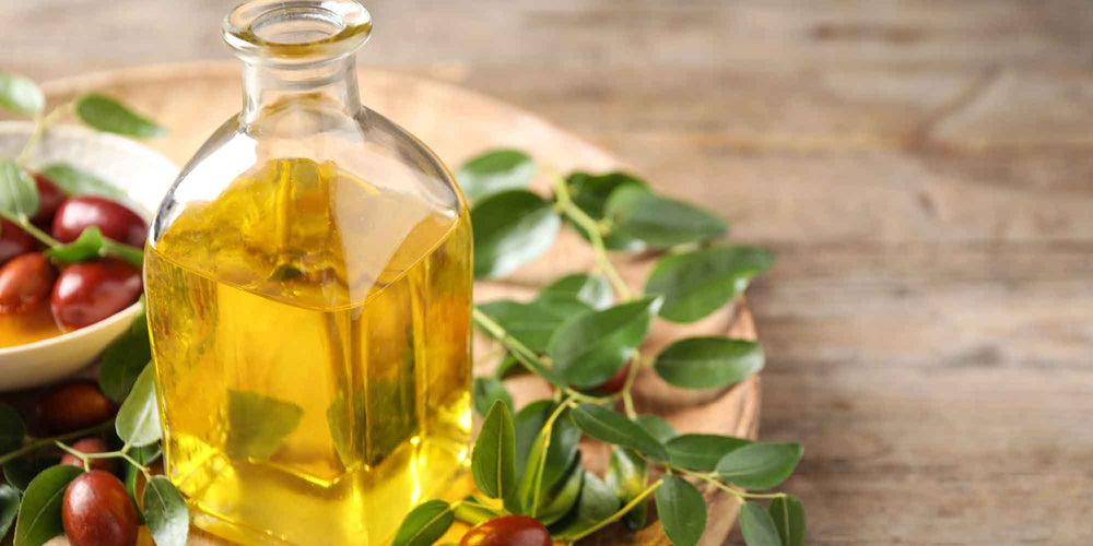 Elegant glass bottle of jojoba oil surrounded by scattered jojoba seeds, showcasing the natural and pure essence of the oil in a sophisticated setting