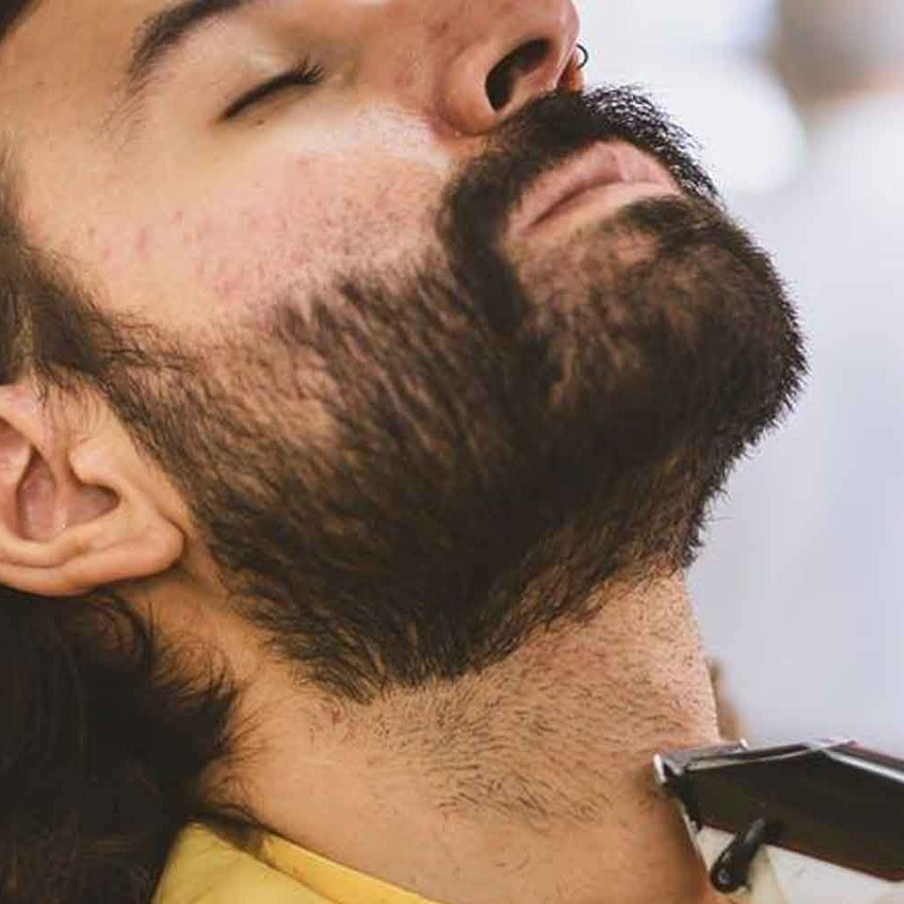 the-modern-gentleman-male-getting-beard-trimmed-at-the-barbers