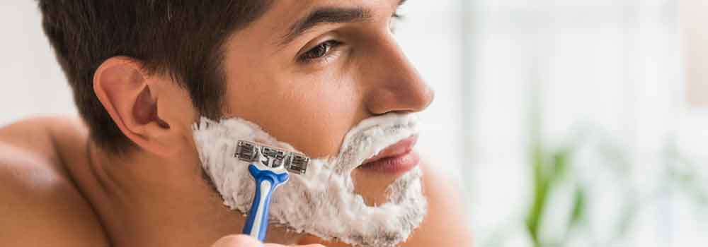 the-modern-gentleman-serious-guy-shaving-his-beard