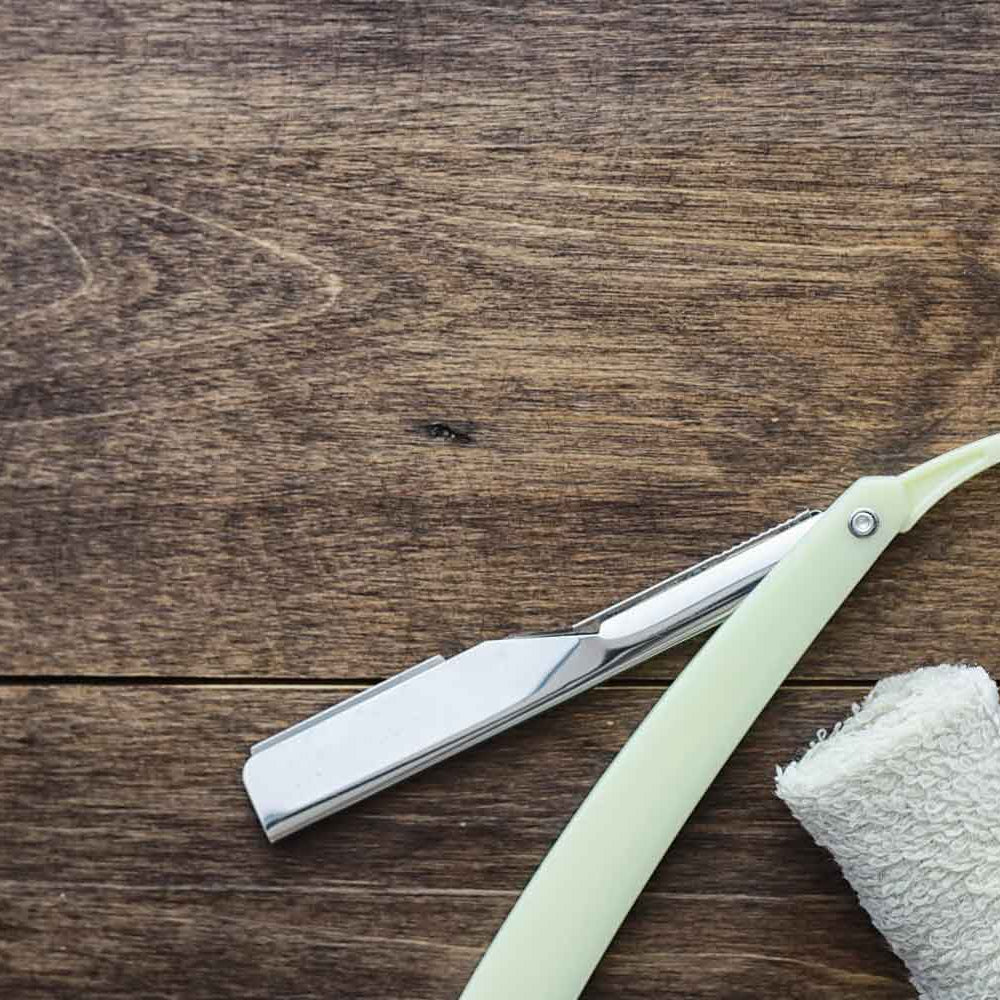 the-modern-gentleman-shaving-accessories-on-a-wooden-board