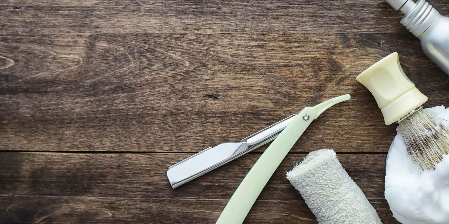 the-modern-gentleman-shaving-accessories-on-a-wooden-board