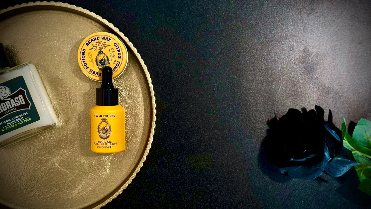Beard oil bottle on a wooden tray with a dark background